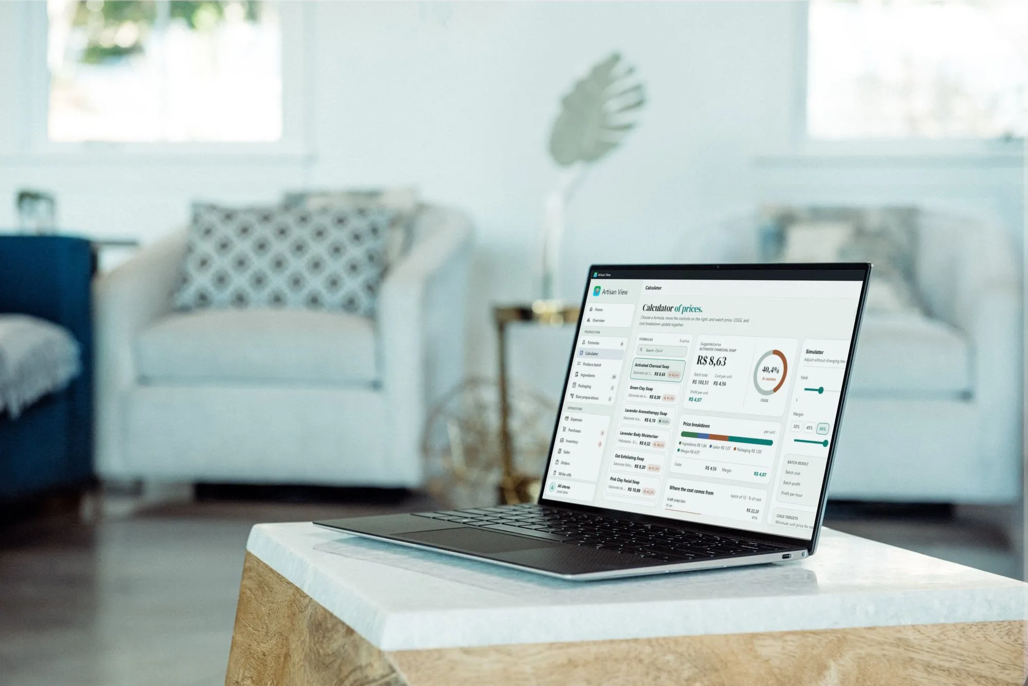 Artisan View on a Windows laptop on a living-room table, showing the price calculator
